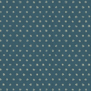 cream colored dotted tiny flowers on textured moody medium-dark muted blue - large scale