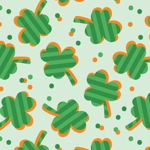 Little striped shamrock sticker style design - retro Irish clover and confetti  for St. Patrick's Day  orange jade green on mint 