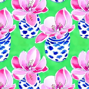 Magnolia flowers in blue and white chinoiserie jars on lime green