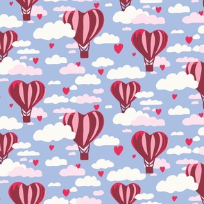 Pink heart hot air balloons in cloudy blue sky large