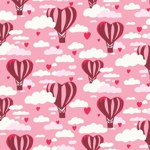 Pink heart hot air balloons in cloudy rose sky small