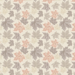 Autumnal maple leaves on beige background