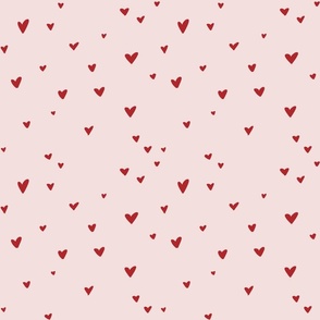 red on muted pink scattered hearts