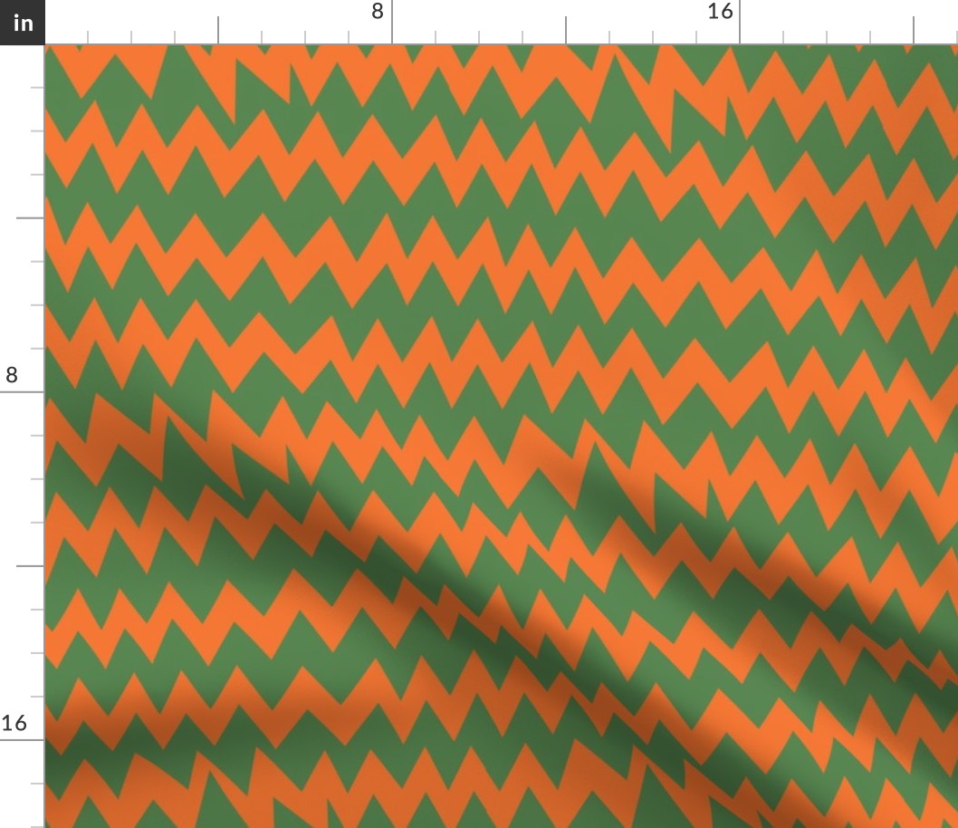 the purple-haired girl’s cardigan (green and orange zig-zags)