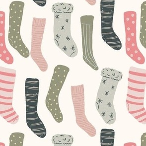 small Stockings Hung with care in cream, pink, peach, artichoke green, and navy blue
