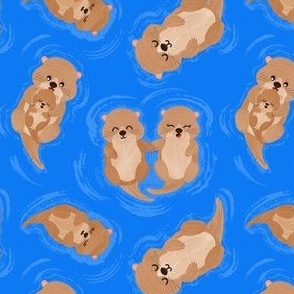 Small Adorable Swimming Otters