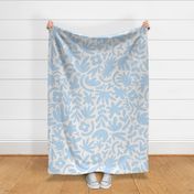 Larger scale neutral jungle cutouts in light sky blue on cream.