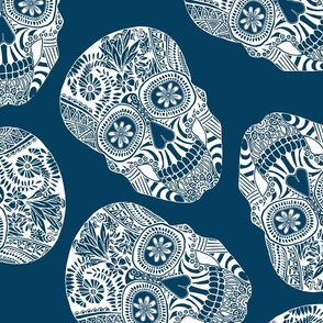 white illustrated skulls on blue