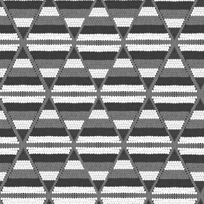 Geometric texture of knitted fabric white with gray and brown