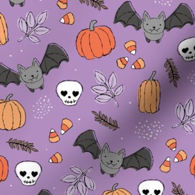 Sweet boho style halloween bats pumpkins and leaves halloween candy garden orange coral lilac on purple violet