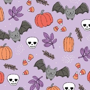 Sweet boho style halloween bats pumpkins and leaves halloween candy garden orange coral on lilac purple 