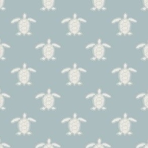 small hand drawn turtles in muted blue and cream