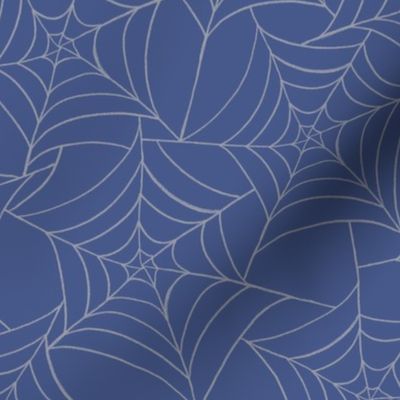 Halloween Spiderwebs on blue background.