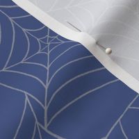 Halloween Spiderwebs on blue background.