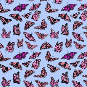 hand painted monarch butterflies in pink on a blue background - smaller scale