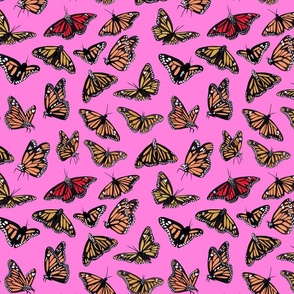 hand painted monarch butterflies in orange on a pink background - smaller scale