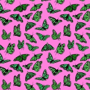 hand painted monarch butterflies in green on a pink background - smaller scale