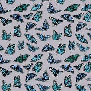 hand painted monarch butterflies in blue on a light grey background - smaller scale
