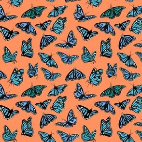 hand painted monarch butterflies in blue on a orange background - smaller scale