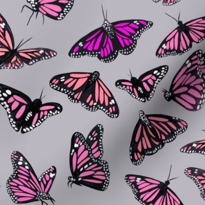 hand painted monarch butterflies in pink on a light grey background - smaller scale