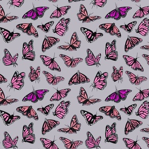 hand painted monarch butterflies in pink on a light grey background - smaller scale