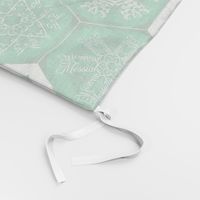 Calligraphic Snowflake napkins in green