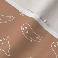 Minimalist boho style ghosts - halloween spooky season ghost outline freehand drawing white on burnt orange caramel