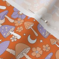 Groovy retro autumn garden - toadstools flowers and mushroom forest vintage Scandinavian design blush orange lilac purple moon and stars halloween palette on tangerine orange   