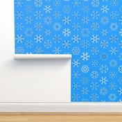 Calligraphic Christmas snowflakes on ice blue