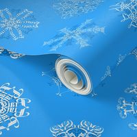 Calligraphic Christmas snowflakes on ice blue