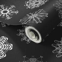 Calligraphic Christmas snowflakes on black