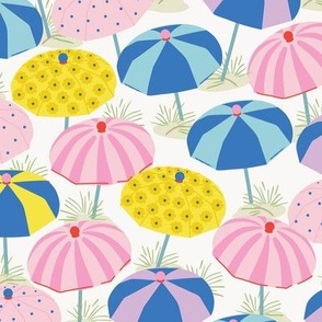 Medium-scaled beach umbrella design in playful polka dots, stripes, and florals and colors of pink, lilac, yellow, red, and blues.
