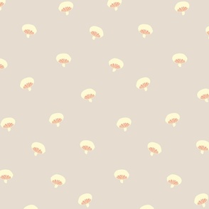  Baby mushrooms scattered on warm neutral grey background  