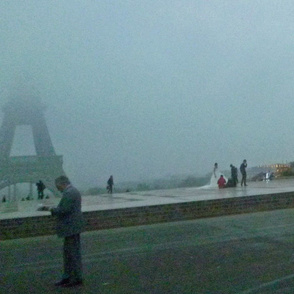 Newly Weds in front of Fogged-in Eiffel Tower 