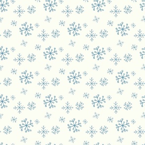 Blue Snowflakes Drawn by Hand on a Winter White Background