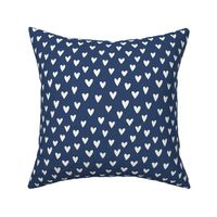 cream hearts on a navy blue background