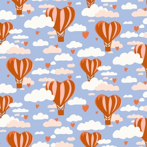 Love is in the air orange heart hot air balloons in dusty blue sky