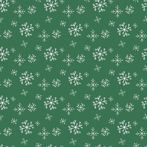 Snowflakes Drawn by Hand on a Christmas Green Background