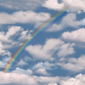 the skies above with partial rainbow