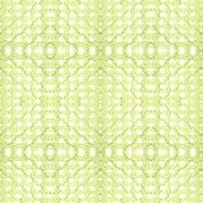 crochet en laine vert pistache sur fond blanc cassé