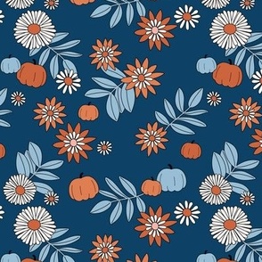 Autumn garden and daisy flowers with leaves and pumpkins colorful boho retro garden orange baby blue on navy  
