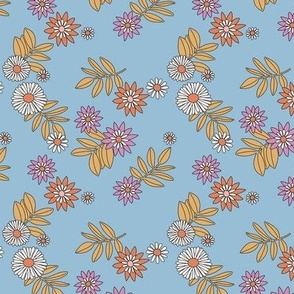 Fall garden ditsy blossom daisies and leaves bohemian vintage flower design orange ochre lilac on blue