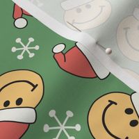 vintage smiley face santas on green