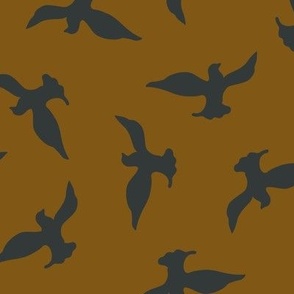 (M) Black birds flying in the copper brown sky