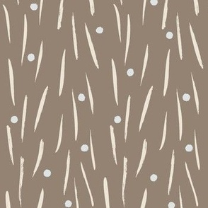 cream lines and grey white dots on tan