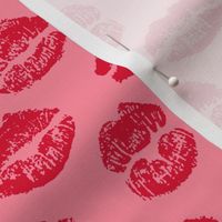 Red kisses for lovers on light pink