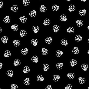 white skulls on a black background