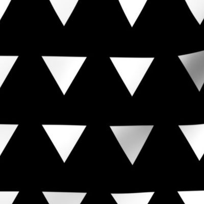 Geometric basic triangles in rows white on black monochrome