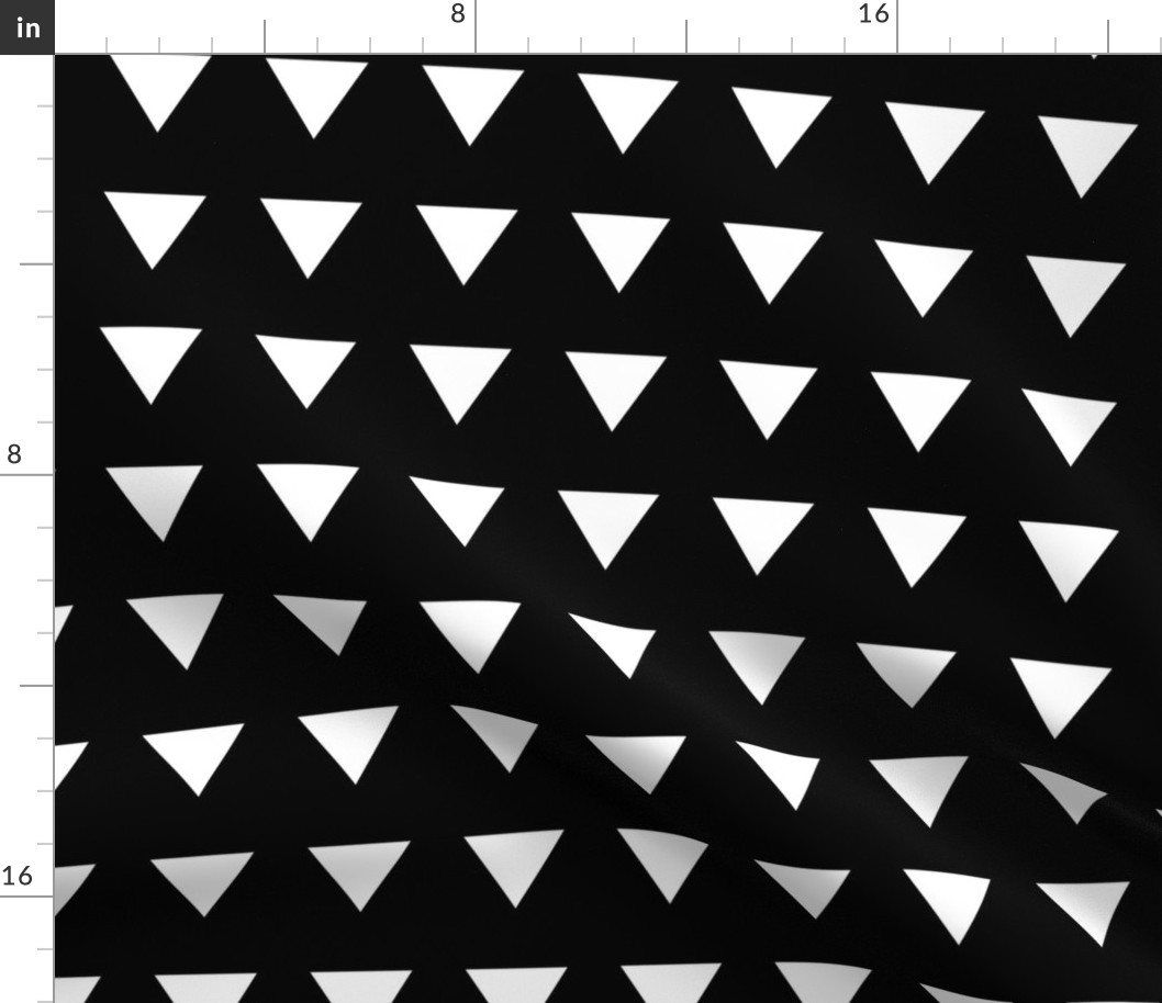 Geometric basic triangles in rows white on black monochrome