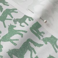 green and white faded horses